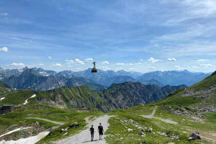 Two hikers descending from Nebelhorn with brilliant alpine ranges
