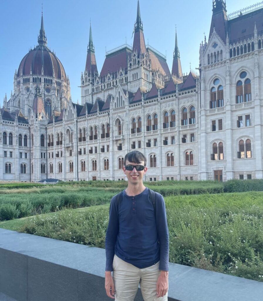 Alex in Budapest parliament as a solo traveler