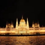 Favorite travel moments of 2025: Budapest Parliament illuminated at night during an evening cruise on the Danube River